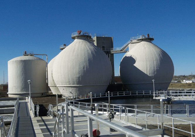 photo of large, round, white biogas plants