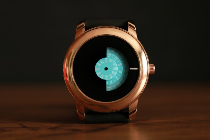 Gold clock with blue arms for minutes and seconds