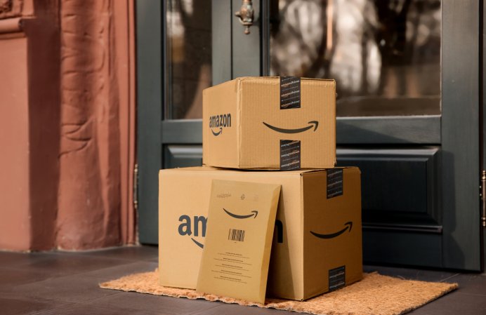 Amazon Prime packages near a doorway.