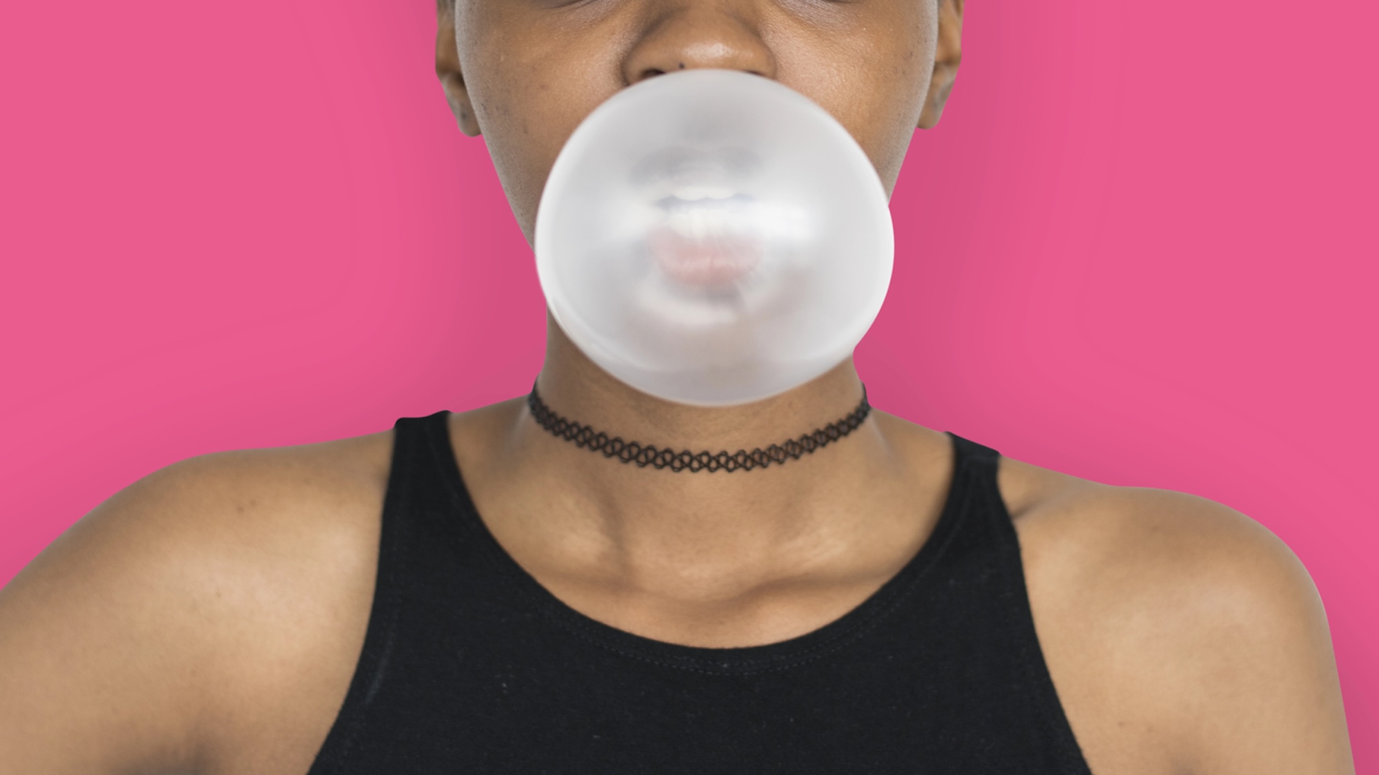 African Woman Blowing Bubble Gum Playful Portrait