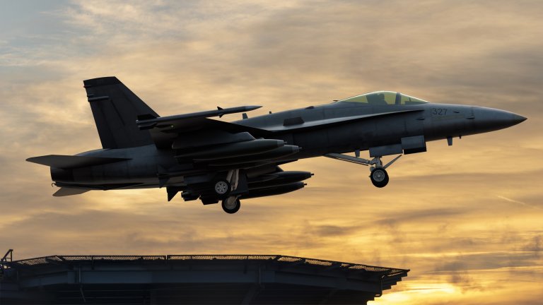 Boeing Super Hornet taking off from the deck of an aircraft carrier